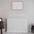 Touchstone Elevate 72015 TV Lift Cabinet in White wood finish pictured in a living room from the front.