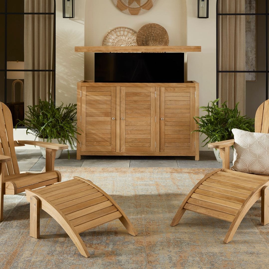 Touchstone TechTeak TV Lift Cabinet lifestyle image shown with Teak chairs