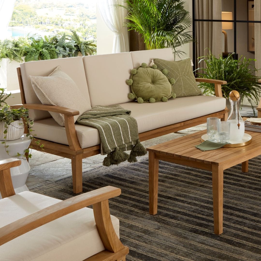 Touchstone Solena Teak Sofa Set lifestyle image close up of 3 seat sofa.