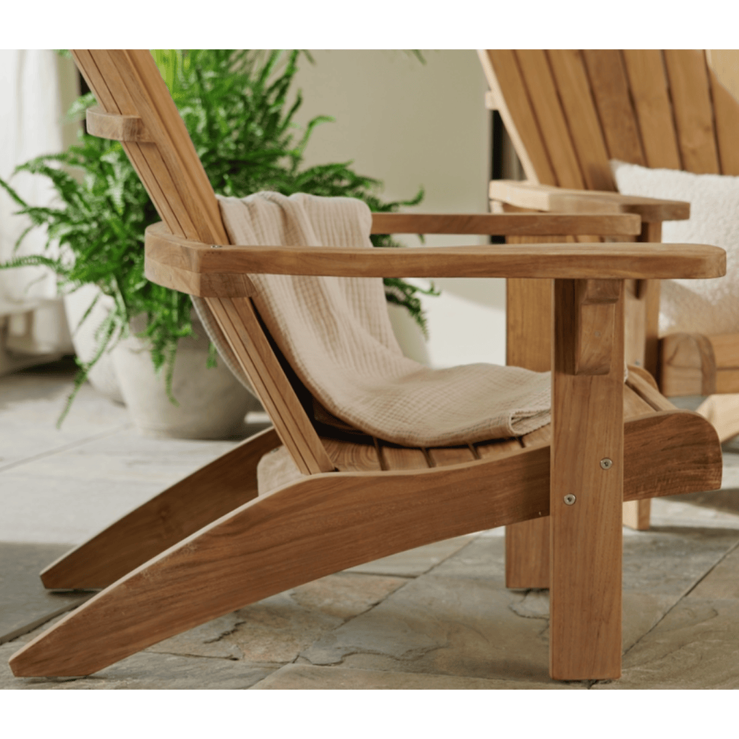 Touchstone Ayenya Teak Adirondack chair lifestyle photo of ergonomic chair.