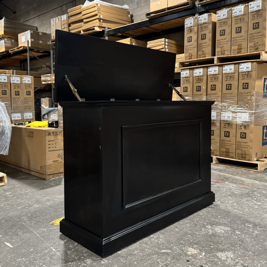 Black Elevate TV Lift Cabinet showroom unit photographed in the warehouse.