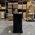 Black Elevate TV Lift Cabinet showroom unit photographed in the warehouse.