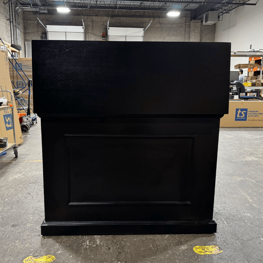 Black Elevate TV Lift Cabinet showroom unit photographed in the warehouse.