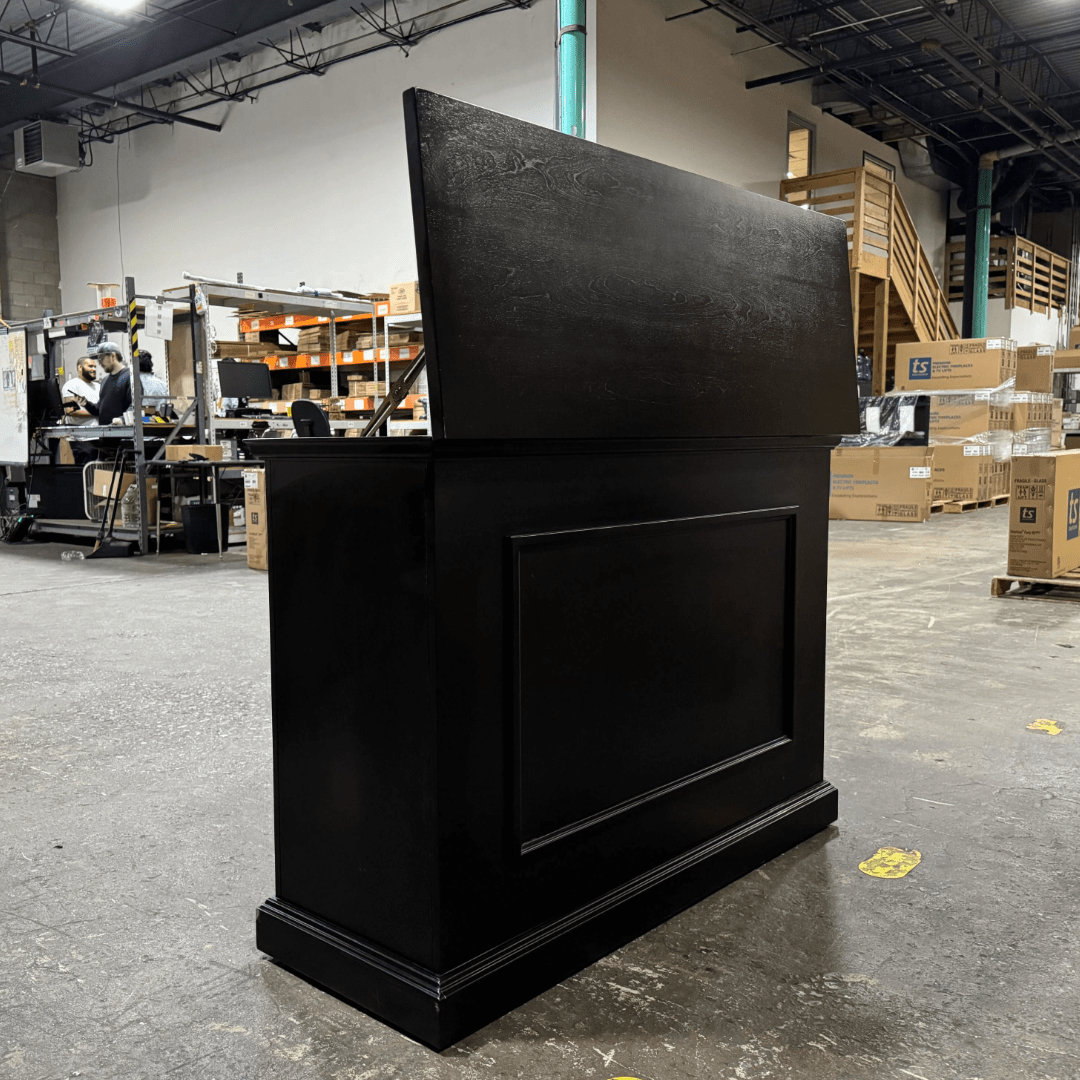 Black Elevate TV Lift Cabinet showroom unit photographed in the warehouse.