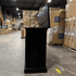 Black Elevate TV Lift Cabinet showroom unit photographed in the warehouse.