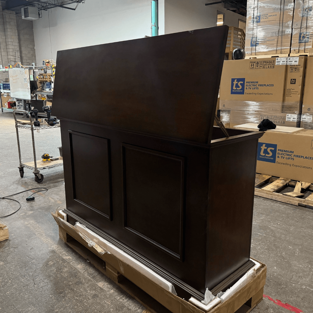 Grand Elevate open box tv lift cabinet photographed in the warehouse.