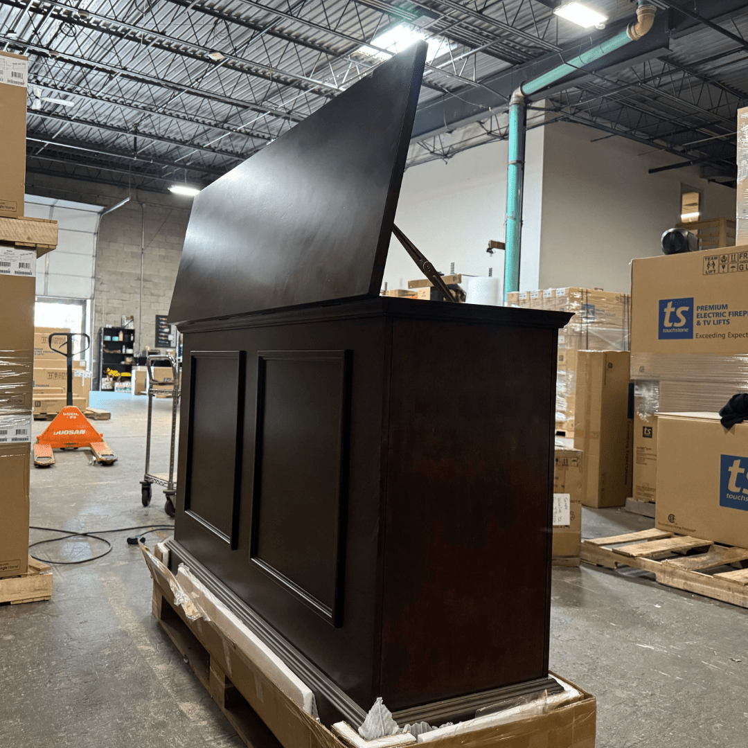 Grand Elevate open box tv lift cabinet photographed in the warehouse.