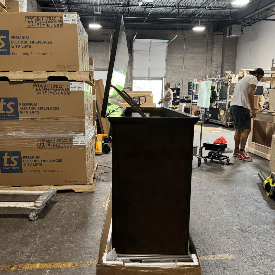 Grand Elevate open box tv lift cabinet photographed in the warehouse.