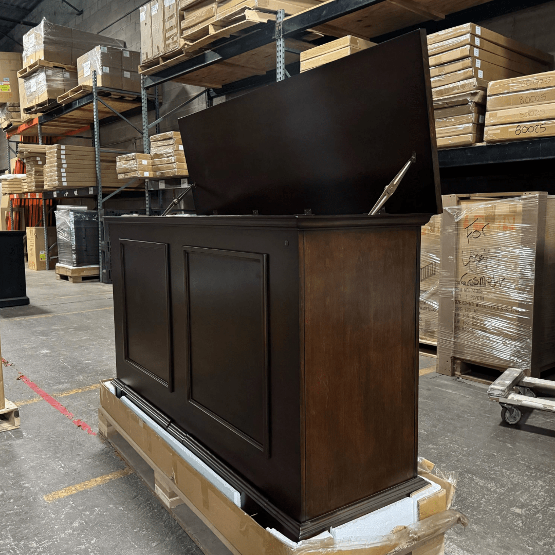 Grand Elevate open box tv lift cabinet photographed in the warehouse.