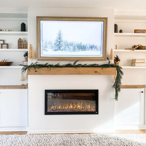 Touchstone Sideline Elite Electric Fireplace surrounded by white built-ins and decorated for holidays @homeaker_mama