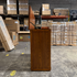 Touchstone Elevate Mission Smart TV Lift Cabinet in a light oak finish photographed in the warehouse - showroom unit.