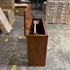 Touchstone Elevate Mission Smart TV Lift Cabinet in a light oak finish photographed in the warehouse - showroom unit.