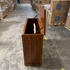 Touchstone Elevate Mission Smart TV Lift Cabinet in a light oak finish photographed in the warehouse - showroom unit.