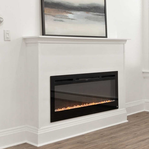 Minimalist white mantel with Touchstone Sideline Electric Fireplace by @kizzoandco