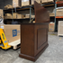 Touchstone Mini Elevate Smart TV Lift Cabinet in espresso finish photographed in the warehouse - showroom unit.
