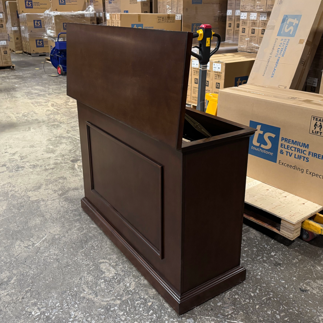 Touchstone Mini Elevate Smart TV Lift Cabinet in espresso finish photographed in the warehouse - showroom unit.