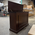 Touchstone Mini Elevate Smart TV Lift Cabinet in espresso finish photographed in the warehouse - showroom unit.