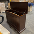Touchstone Mini Elevate Smart TV Lift Cabinet in espresso finish photographed in the warehouse - showroom unit.