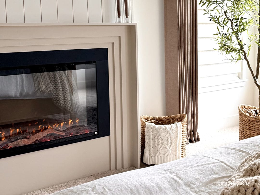 Touchstone Fireplug Pro Electric Fireplace Firebox Insert in bedroom, photo credit @thisgeorgiaclay