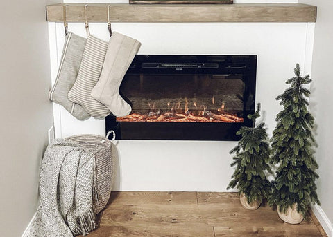 Touchstone Sideline Electric Fireplace with holiday decor by athomewithjhackie1
