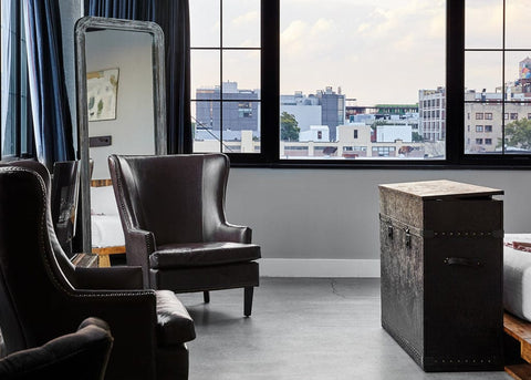 Touchstone Elevate Leather Wrapped Vintage Trunk TV Lift Cabinet in room with a view