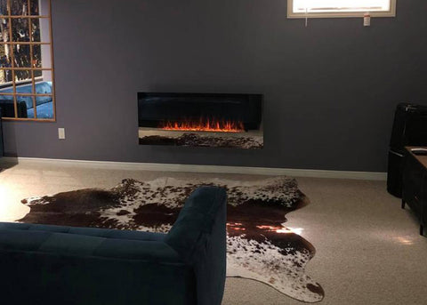 Touchstone Mirror Onyx Electric Fireplace showing the refection of the room