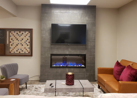 Touchstone Sideline Elite 50 Electric Fireplace with dark gray tile fireplace and TV mounted above
