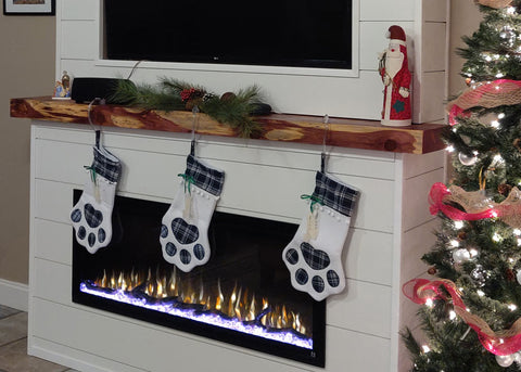 Touchstone Sideline Elite Electric Fireplace in white shiplap mantel with Christmas stockings