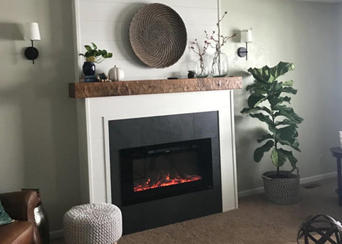 Touchstone Sideline 50 Electric Fireplace in white mantel with natural wood ledge