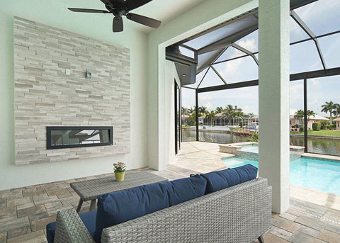 Sideline Outdoor Electric Fireplace in covered pool area by Premier Cape Construction