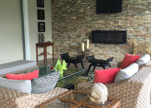 Touchstone Outdoor Sideline Electric Fireplace in the sunroom