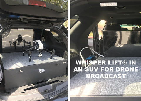 Whisper Lift TV Lift Mechanism mounted in the back of a sports utility vehicle for large screen drone camera viewing.