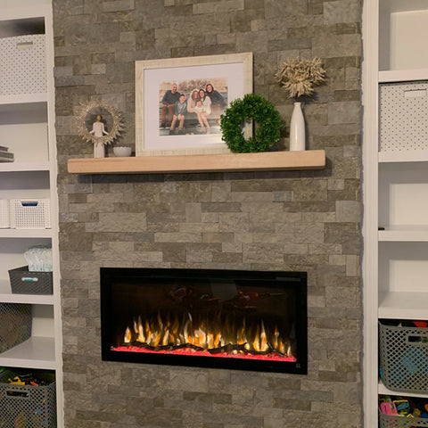 Touchstone Sideline Elite 42 Electric Fireplace in stone wall with light wood  mantel