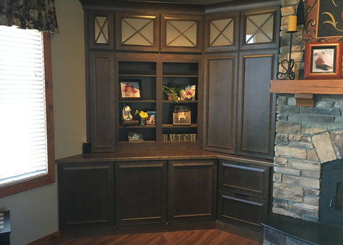 The Whisper Lift II lowers the TV into the cabinet so the shelves are in full view.