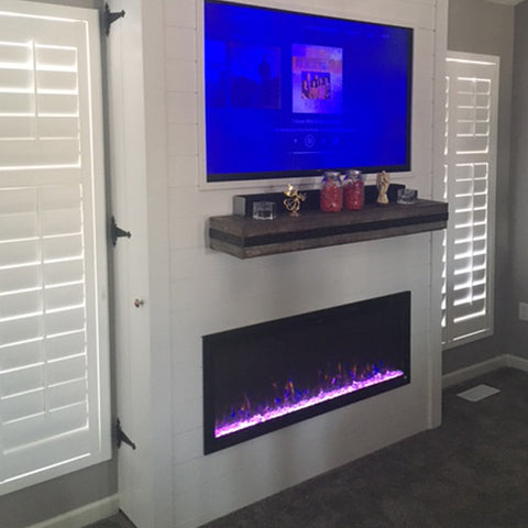 Touchstone Sideline Elite Electric Fireplace in hinged bump out wall with mantel