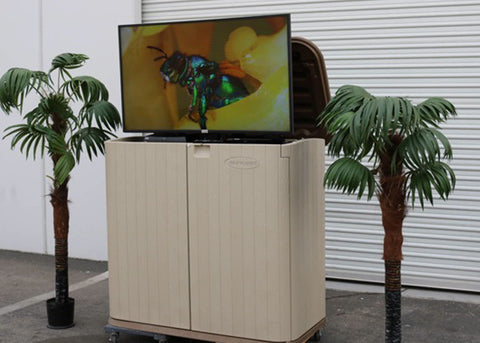 Whisper Lift TV lift in an outdoor storage chest