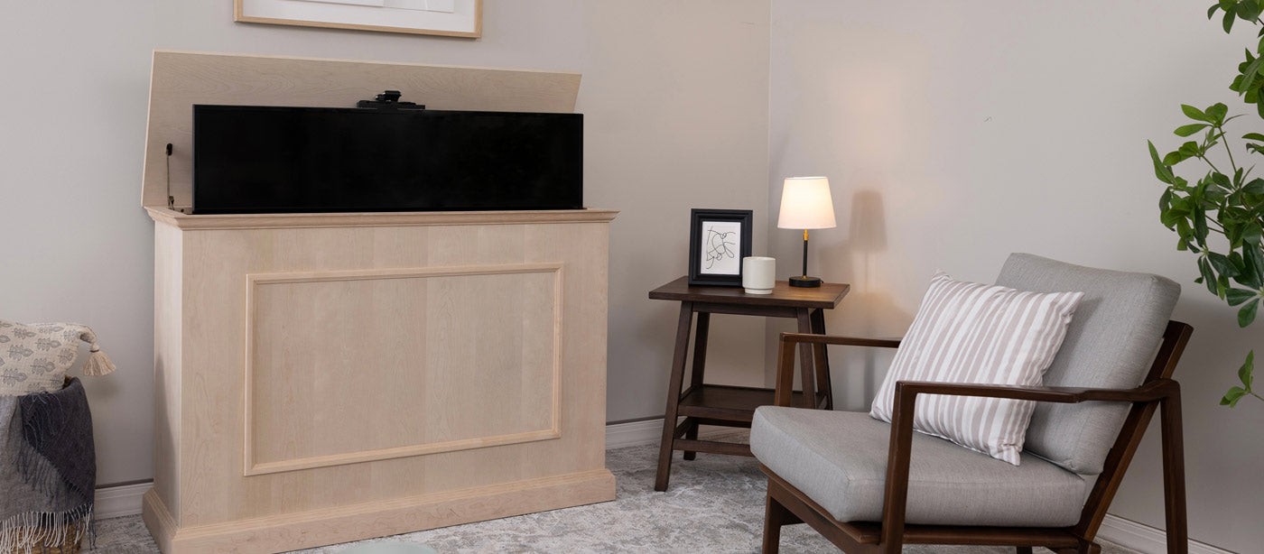 Touchstone Elevate TV Lift Cabinet in unfinished wood positioned in living room