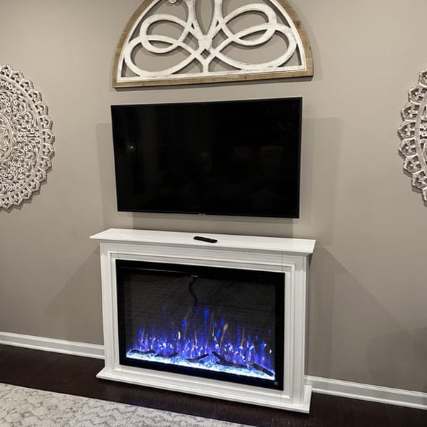 The Touchstone Encase Surround Mantel with Sideline Forte Elite Smart Electric Fireplace in living room with TV mounted above