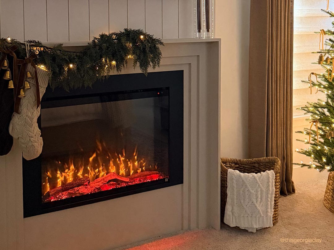 Touchstone Fireplug Pro Smart Electric Fireplace Insert in surround mantel decorated for the holidays. Photo credit: @thisgeorgiaclay