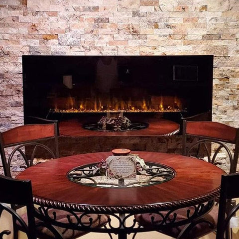 Touchstone wall mount electric fireplace in brick wall dining room by customer Theresa
