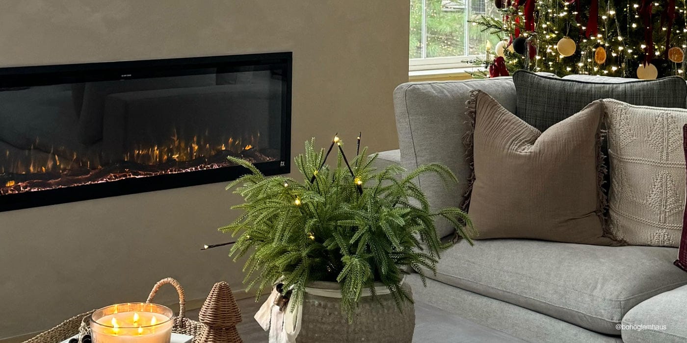 Touchstone Sideline Elite® Smart Electric Fireplace with holiday decor, photo credit @bohoglamhaus