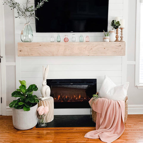 Touchstone Sideline 36 Electric Fireplace in white shiplap accent wall with spring decor by @houseofus