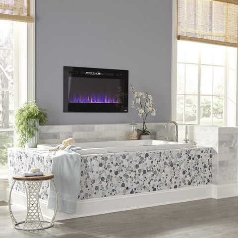 Touchstone Sideline 36 Electric Fireplace in bathroom shown with blue and orange flame display