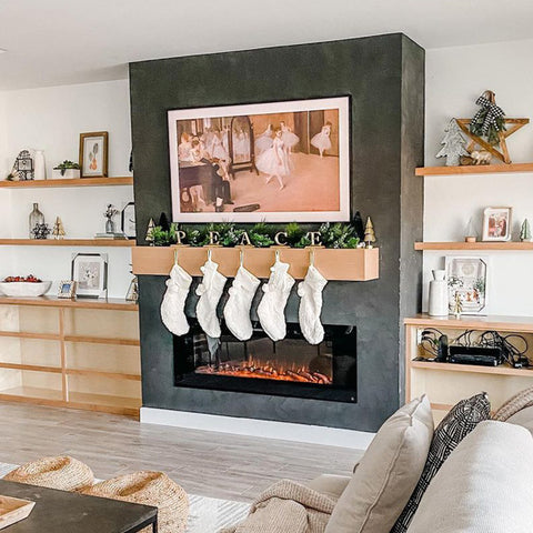 Touchstone Sideline 60 Electric Fireplace in dark gray clay bump out wall with light wood mantel by @hey.summer.home
