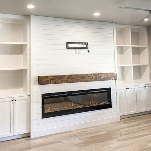 Touchstone Sideline 84 Electric Fireplace in white shiplap wall with built in shelving surround and wood mantel