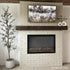 Touchstone Sideline Elite Forte Smart Electric Fireplace in white brick accent wall by @stripped.and.styled