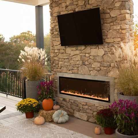 Touchstone Sideline Elite Outdoor Electric Fireplace decorated for Autumn