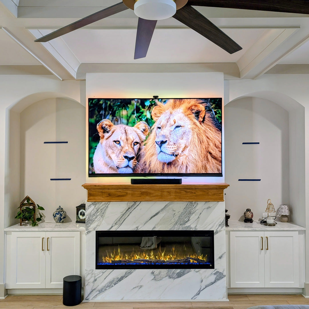 Touchstone Sideline Elite Pro 60 Smart Electric Fireplace in marble surround wall Cox Classic Homes customer Alex