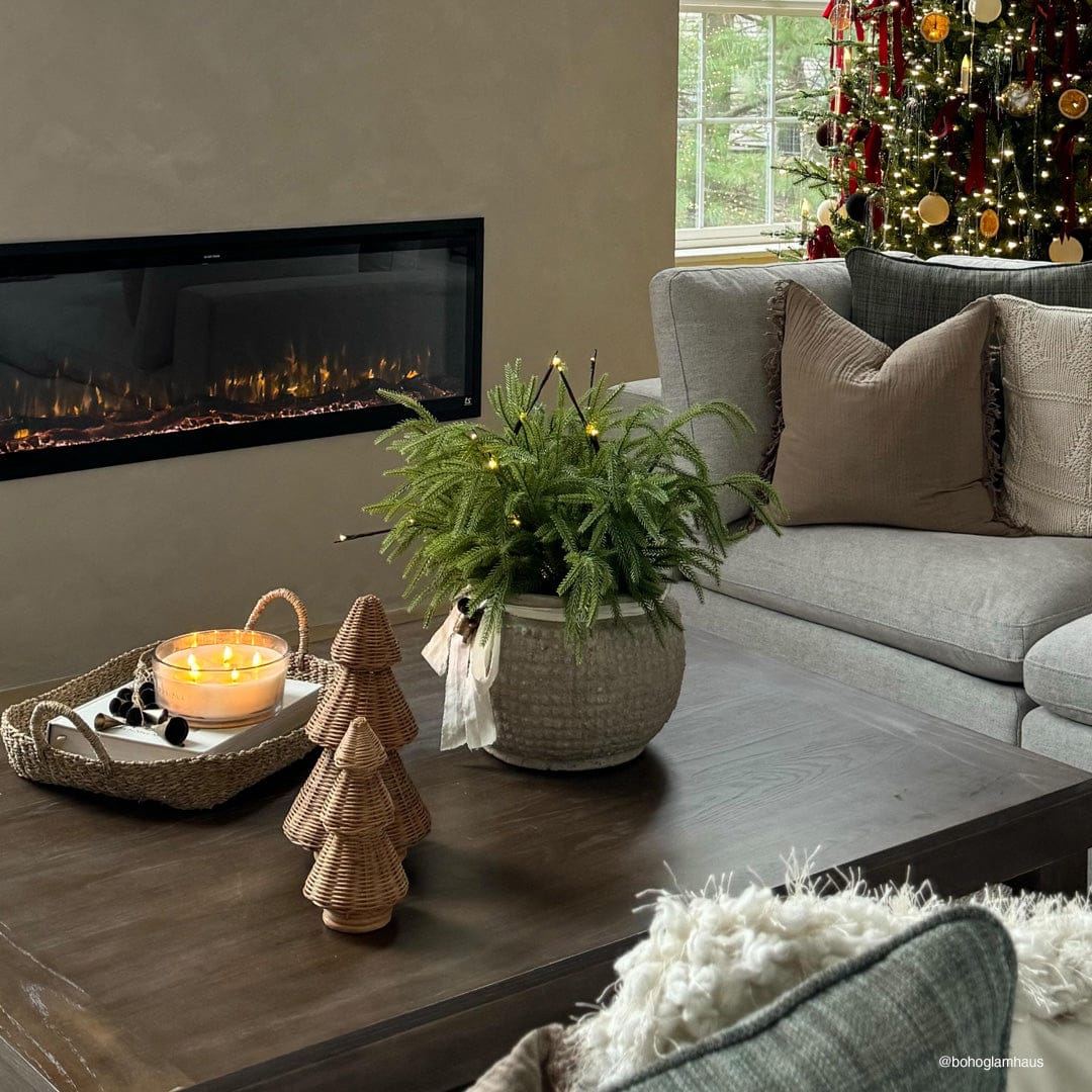 Touchstone Sideline Elite Smart Electric Fireplace with holiday decor, photo credit @bohoglamhaus