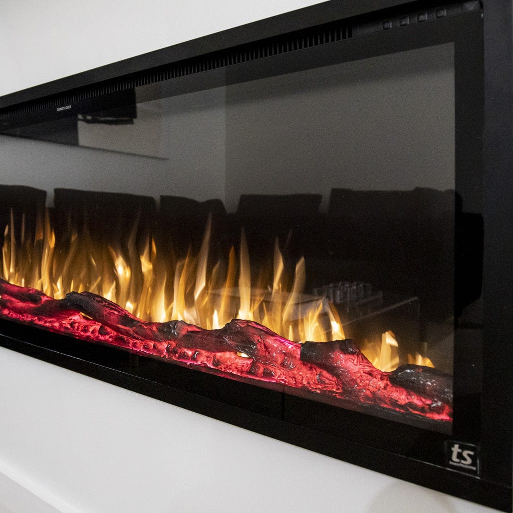 Closeup of the LED flame display of the Touchstone Sideline Elite® Smart Electric Fireplace shown with faux logs.